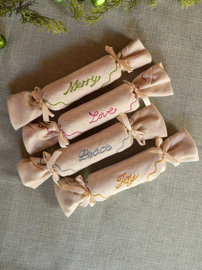 Set of four Christmas phrase crackers