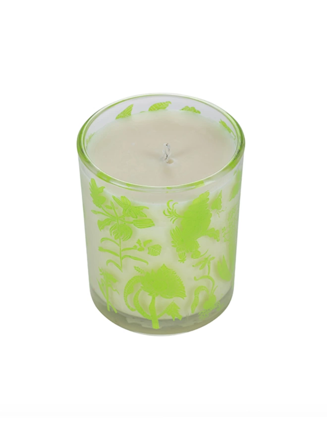 laura's floral, wild fig & grape charity candle in a reusable glass with bright green illustrations