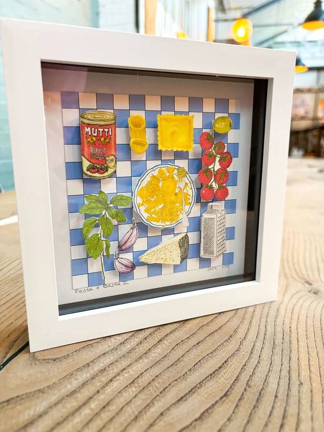 Colourful framed collage featuring Mediterranean food, with vibrant pasta dishes, tomatoes, and olive, cheese and basil set against a blue and white checkered backdrop. Perfect for adding a touch of Italian culinary charm 