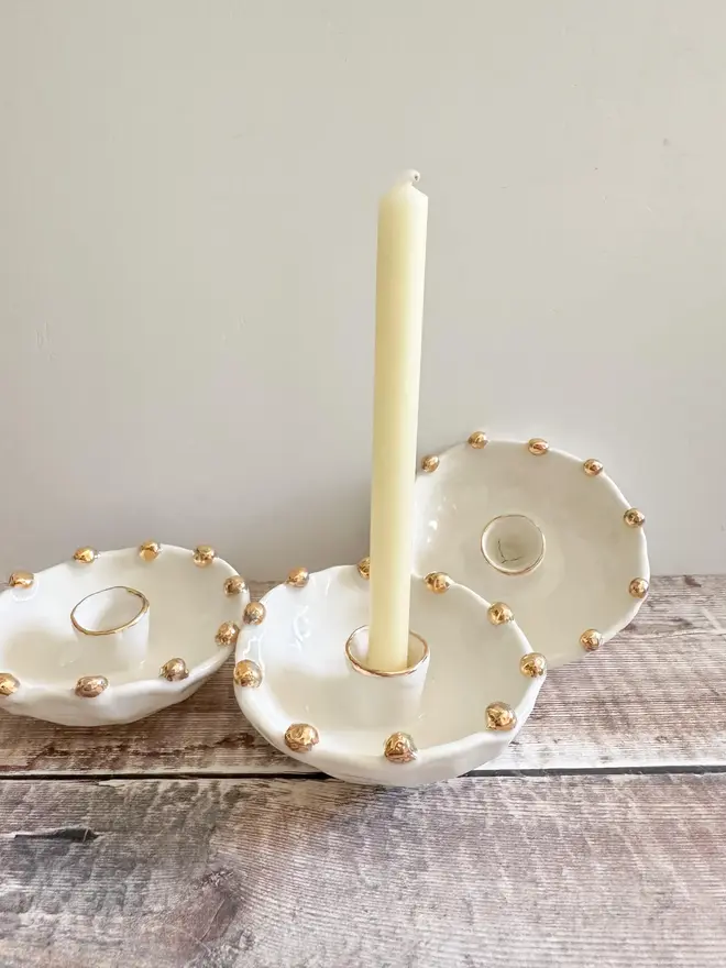 Handmade Gold Star Porcelain Candle Holder Gift (Set Of 3), set of three candle holders on a table. 
