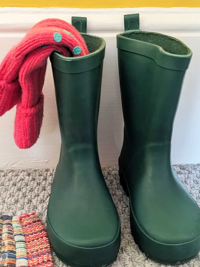 Pink Kids Socks Displayed In Green Wellington Boots