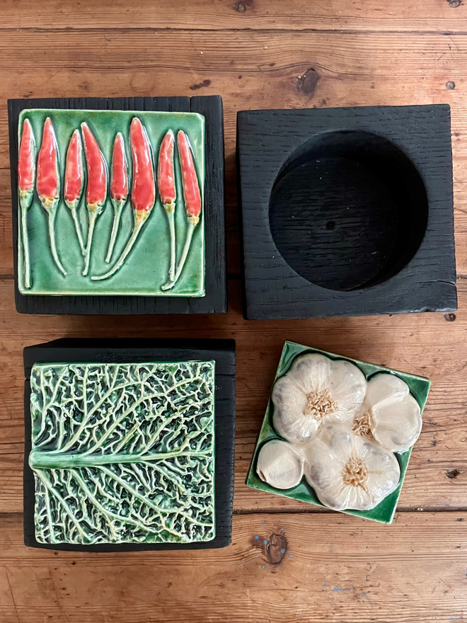 Charred black oak pots with chilli pepper ceramic lid