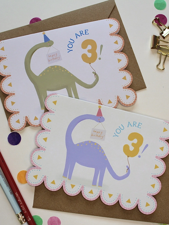 illustrated dinosaur birthday card. scallop edged card illustrated with stegosaurus.