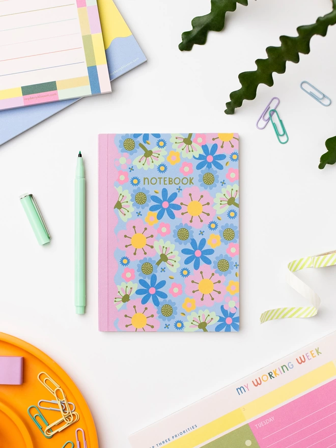 The colourful Raspberry Blossom retro floral A6 duo notebook set in blue