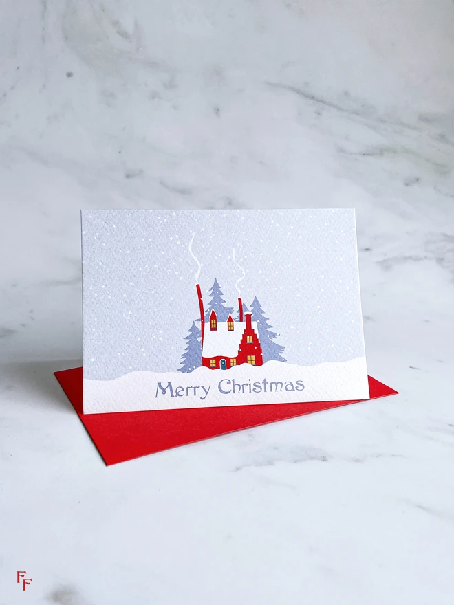 cosy christmas cabin 'merry christmas' charity christmas card, blue and red, illustrated cabin, vintage aesthetic, flora fricker