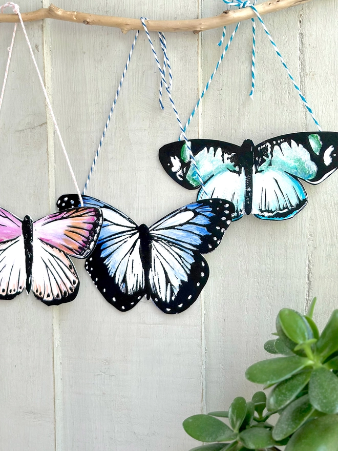 3 Hand Painted Butterflies. Set Of Linocut Wall Hangings, Blue, teak and pink butterflies shown 