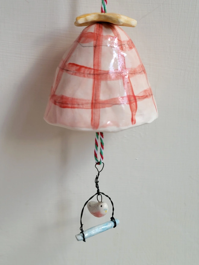 pink ceramic bell with budgie