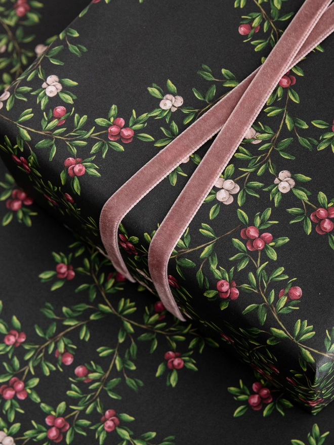 dark navy base with a pink and red berry pattern