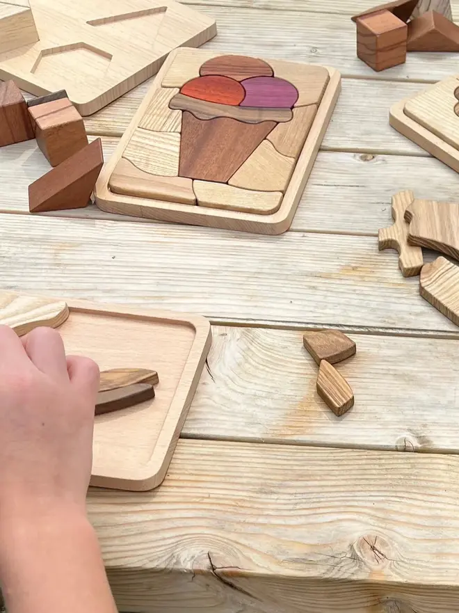 Sweet Scoops Wooden Persistence Jigsaw Puzzle Heirloom Toy, on a table. 