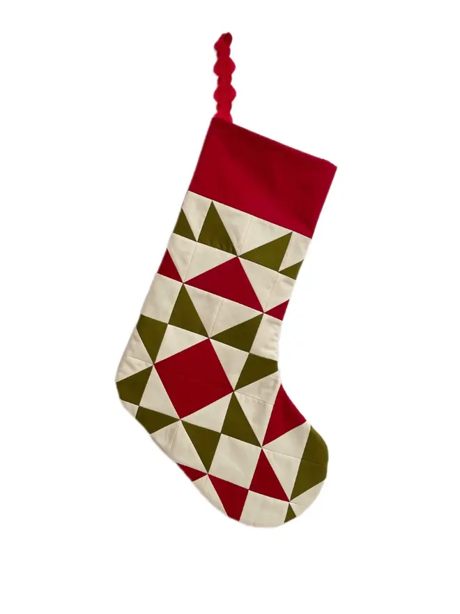 Spruce Patchwork Stocking, against a white background. 