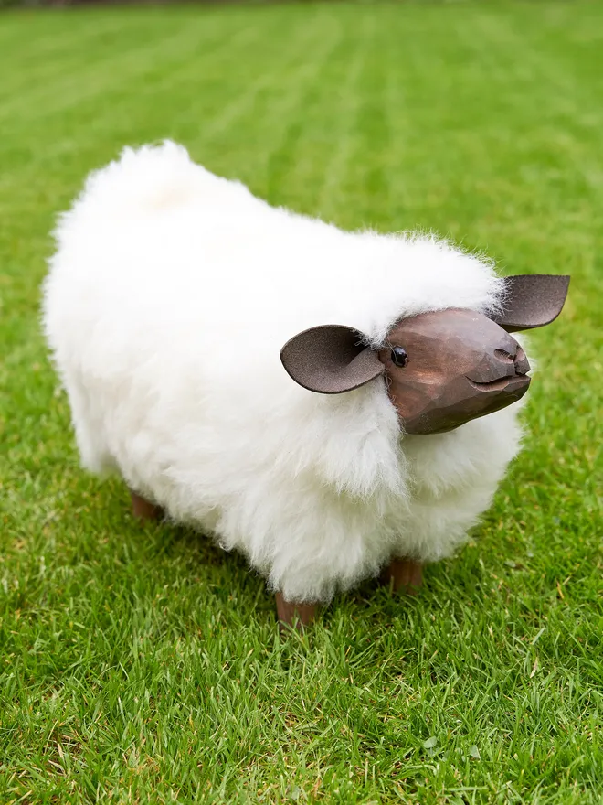 'Mirabeaux' sheep footstool placed in the garden for spring 