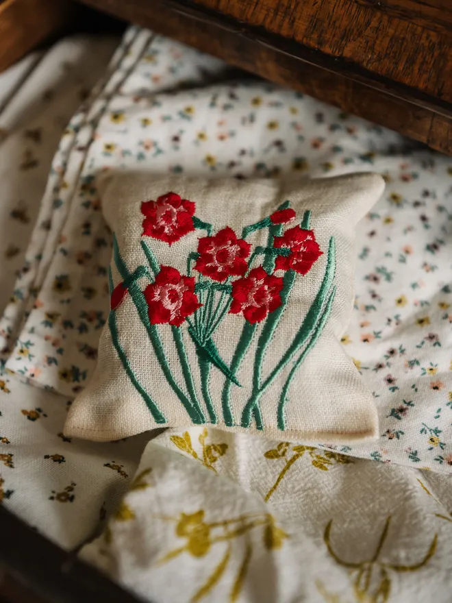Floral red bloom Lavender Sachet. A Sachet of Lavender with embroidered floral design.