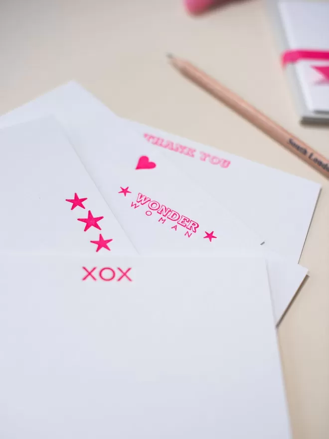 South London Letterpress neon heart card seen with the Wonder Woman, Neon Pink stars and XOX cards.