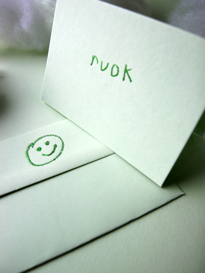 pistachio coloured card with ruok short for 'are you ok' hand foiled in kids hand writing
