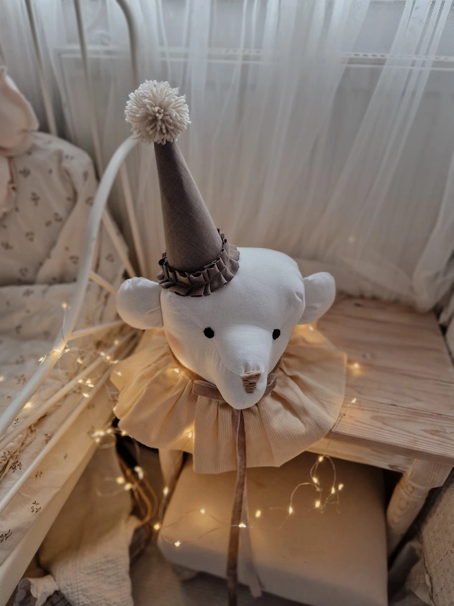 Bear Head Nursery Decoration, a bear decoration sitting against a wall in a child's decorated bedroom. 