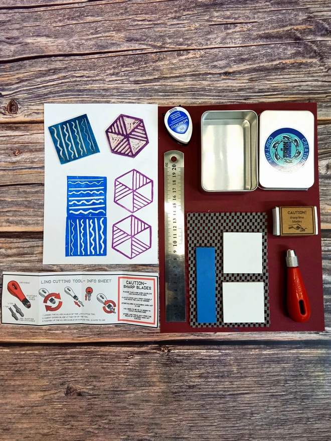 Carving tin with printed examples carving tools lino and ink stamp