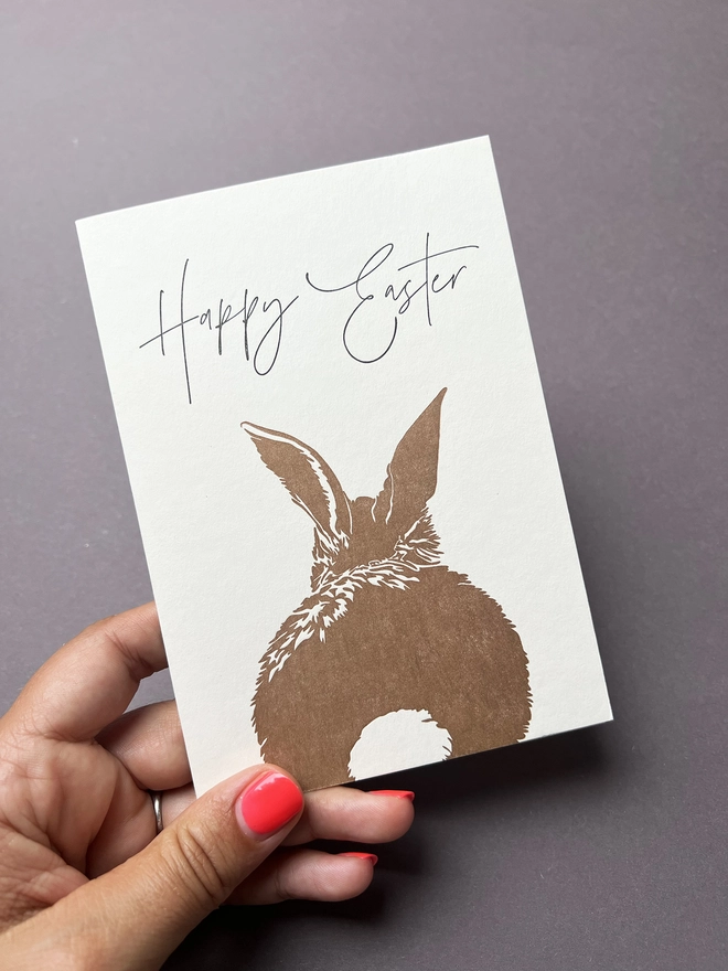 Easter Bunny card being held up.