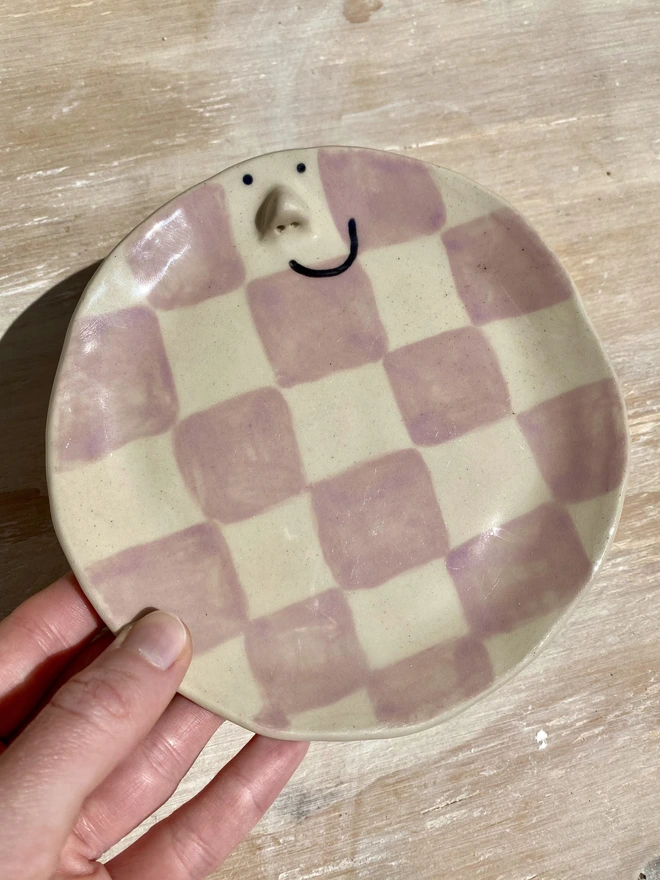 violet ceramic side plate - held - angle