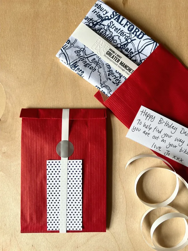 Gift wrap option, a Mr.PS Greater Manchester Handkerchief in red paper, white ribbon and dotty gift tag