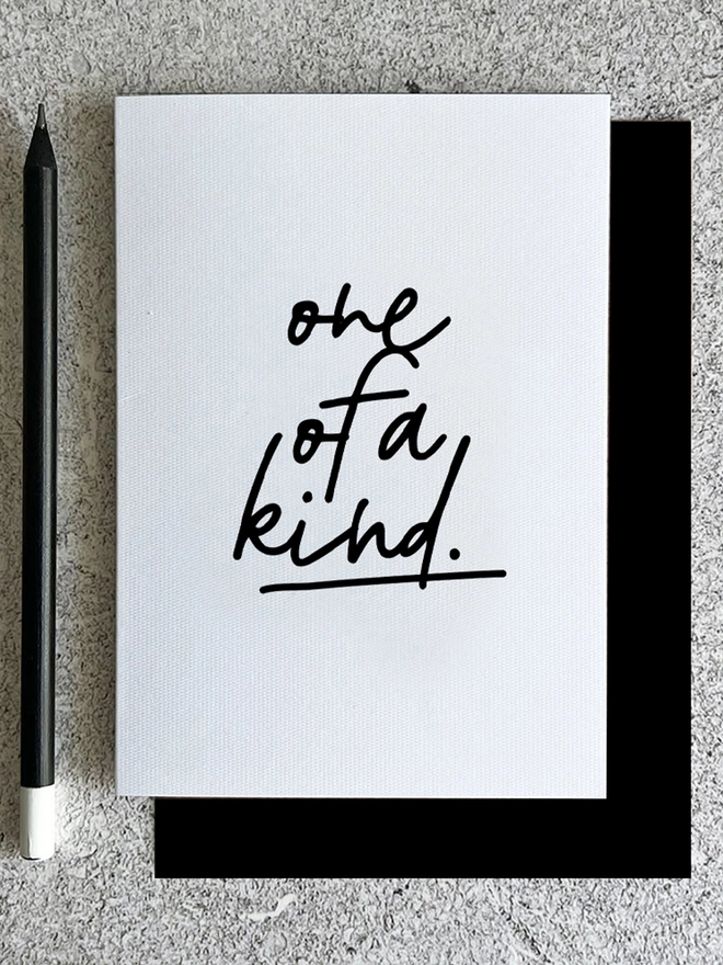 White A6 card with 'One of a Kind' handwritten font and black envelope friendship card