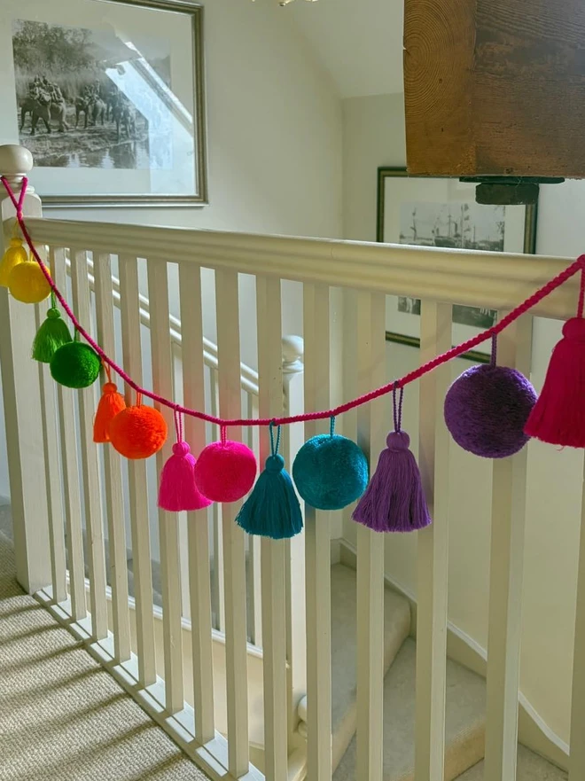 Jumbo Fiesta Garland by pom pom galore wool pom poms and cotton tassels in bright colours 