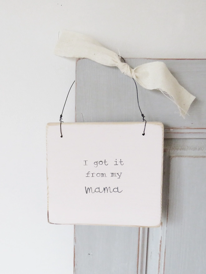 pale pink hand painted wooden hanging sign