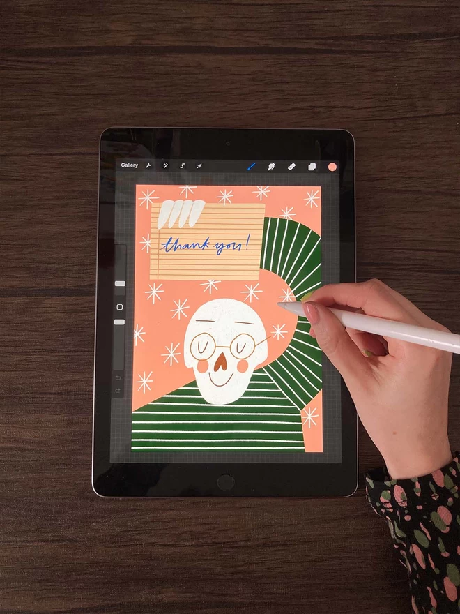 Hand drawing a thank you note on an iPad