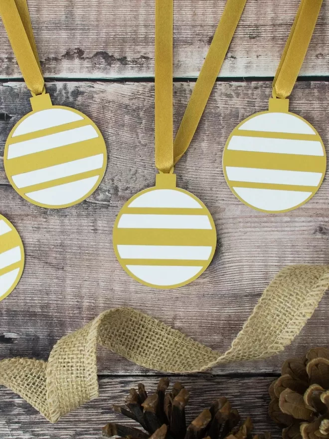 Gold and White Christmas Bauble Gift Tags with gold satin ribbon ties.