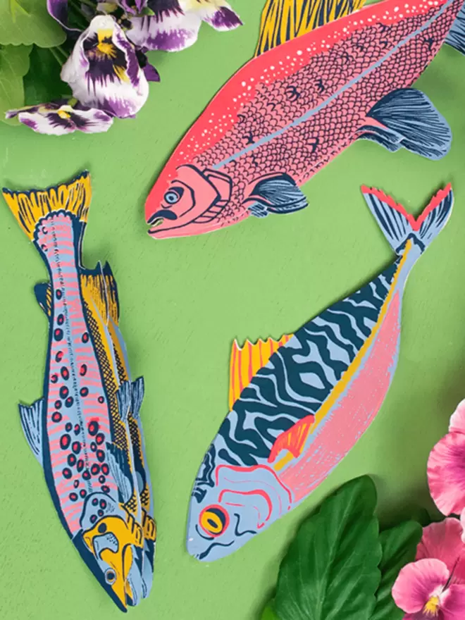 Close-up, detailed shot: all 3 different of the fish greeting cards
