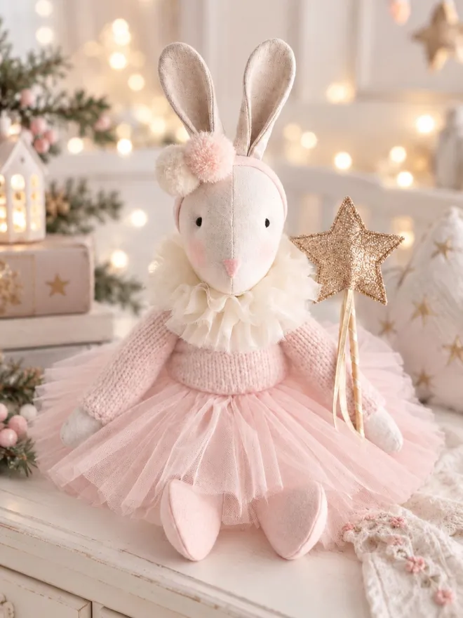 Verity Isabelle ballerina bunny in a soft Christmas nursery setting with pale pink tutu, gold star wand and twinkle lights.