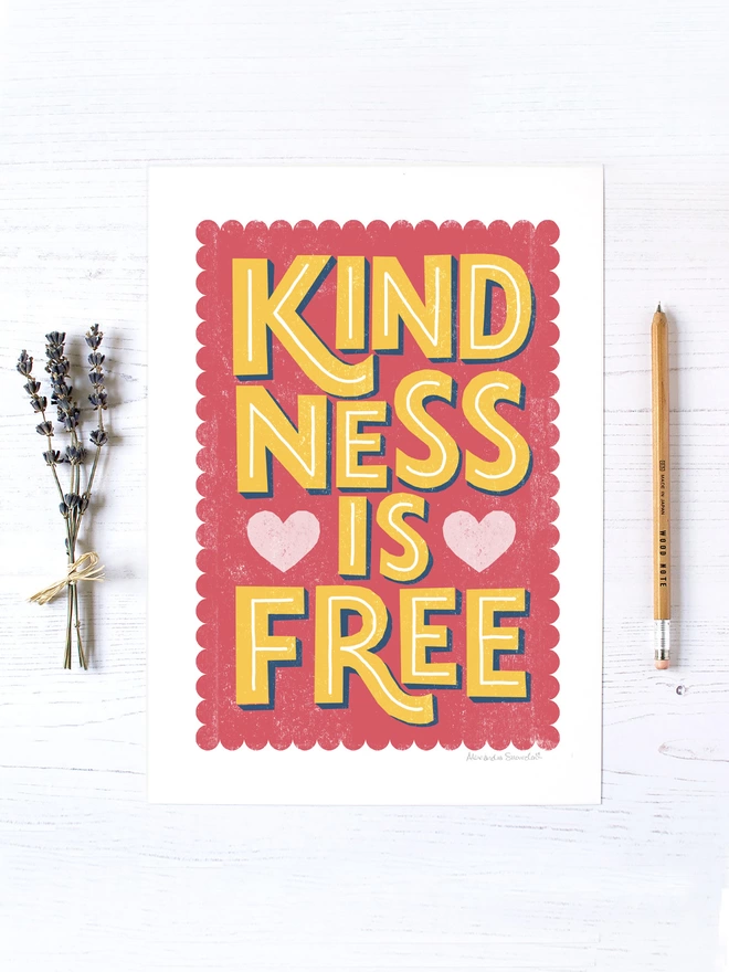 pink and yellow kindness is free print with lavender and wood pencil