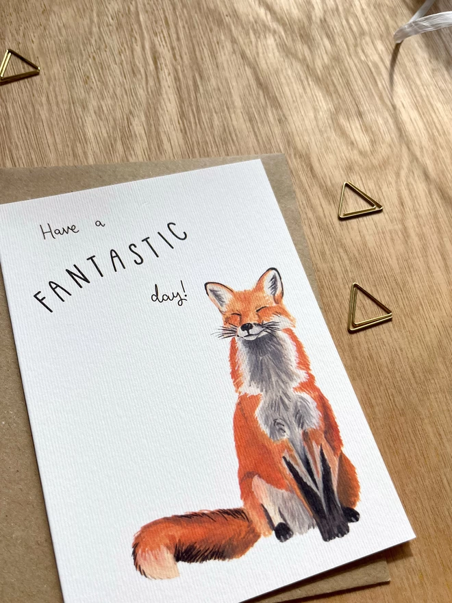 Greetings card with a happy looking red fox and the phrase ‘have a fantastic day”