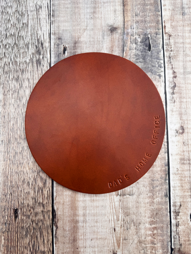 Tan leather mouse mat.