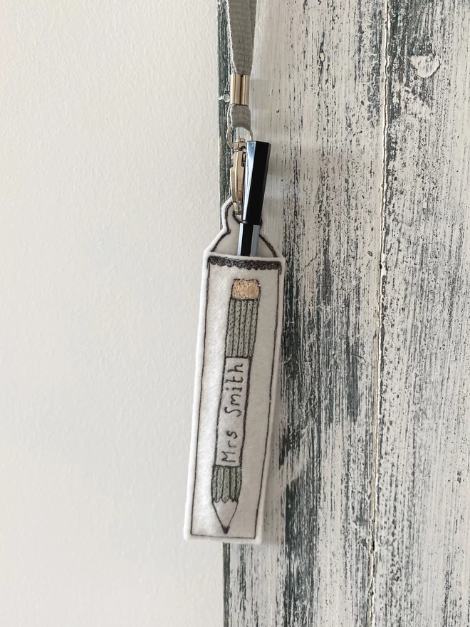 Personalised Teachers Pen Holder Lanyard hanging on a door
