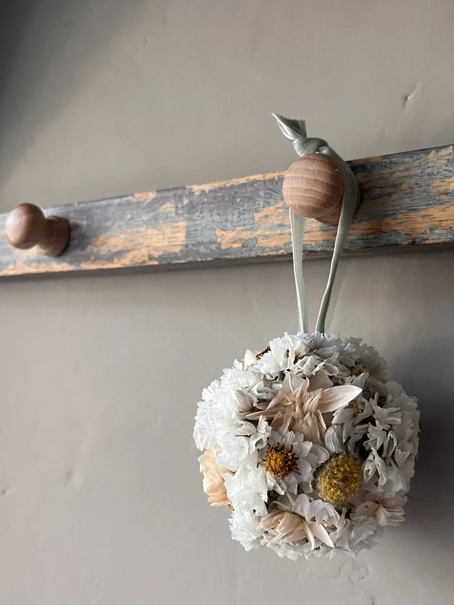 Snow Dried Flower Bauble. A dried flower bauble made of seasonal white flowers.