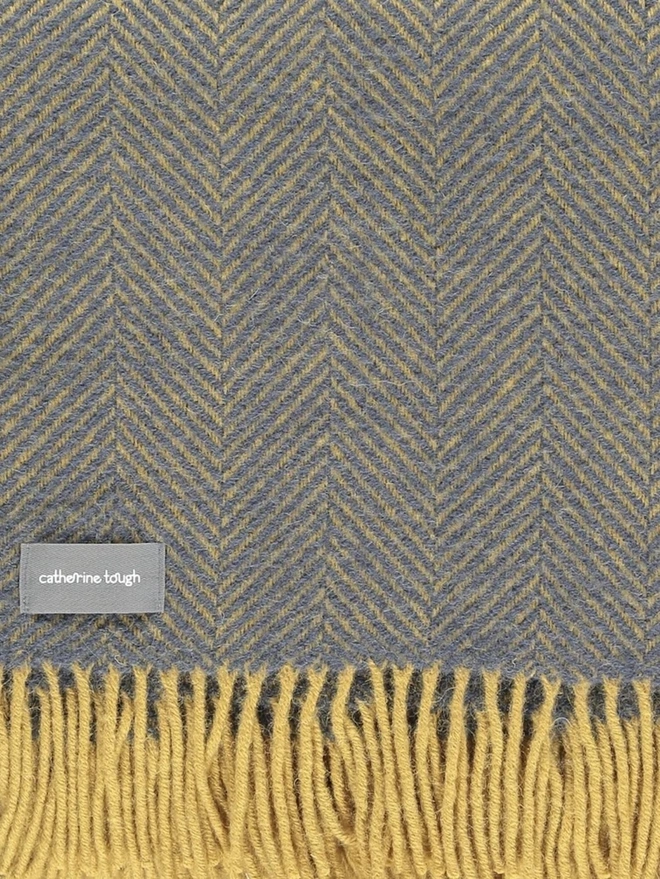 Organic Wool Throw, an organic wool throw folded on a white surface. 