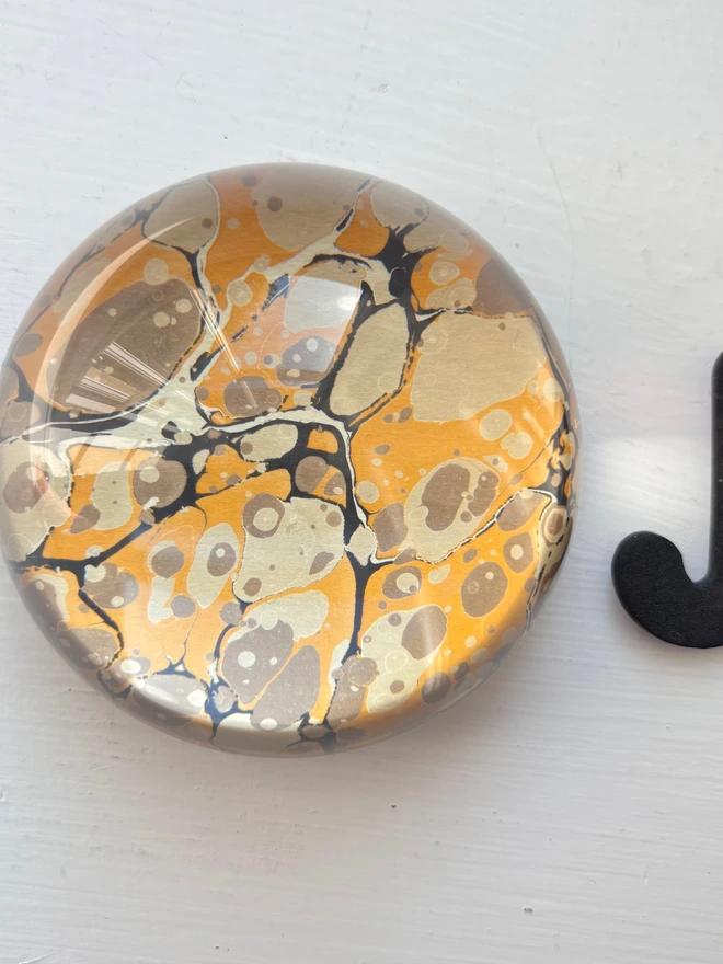 Small Paperweight. A paperweight in J
