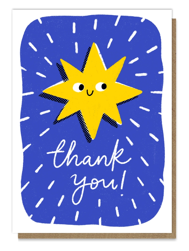 Letterpress card showing a yellow smiling star on a blue background with white lines indicating light. The wording says "thank you!" in white lettering.