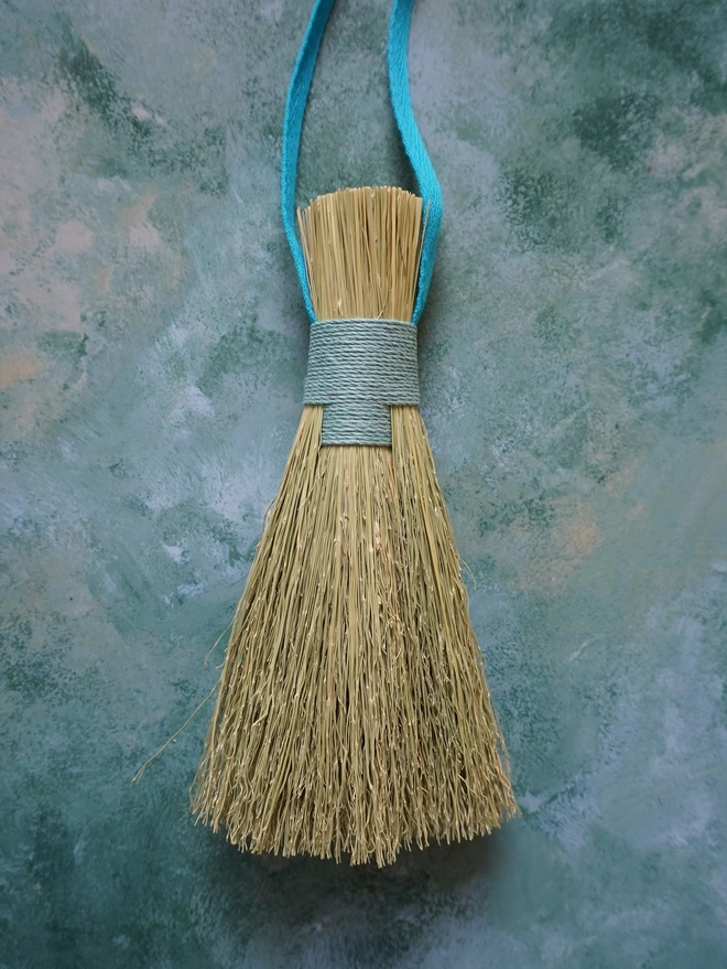 Handmade broomcorn bundle brush with light blue hemp cord binding