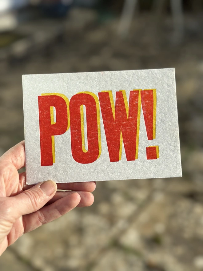 Pow letterpress postcard in hand