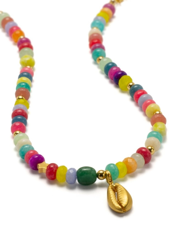 Candy girl beaded necklace. A gemstone beaded necklace with a gold conch shell charm.