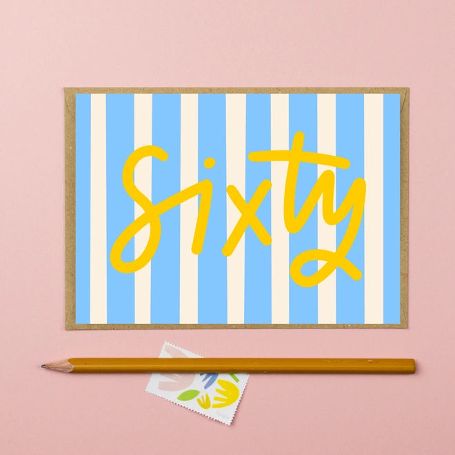 A sixtieth birthday card featuring the word sixty on a blue striped background