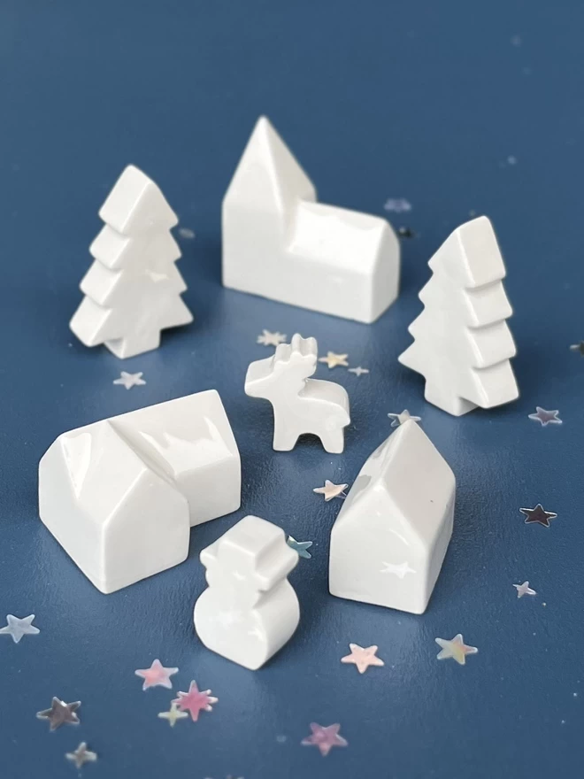 mini a church, house, cottage, snowman, deer and 2 Christmas trees handmade in a white/cream clay