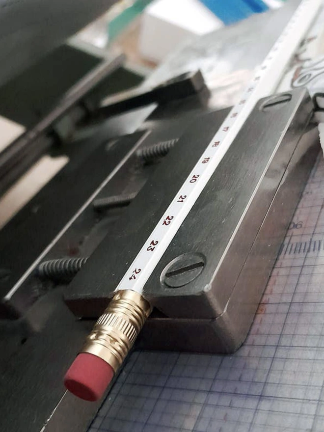 Odd Goose Stationery Advent Pencil close up of making process in traditional foil printing press