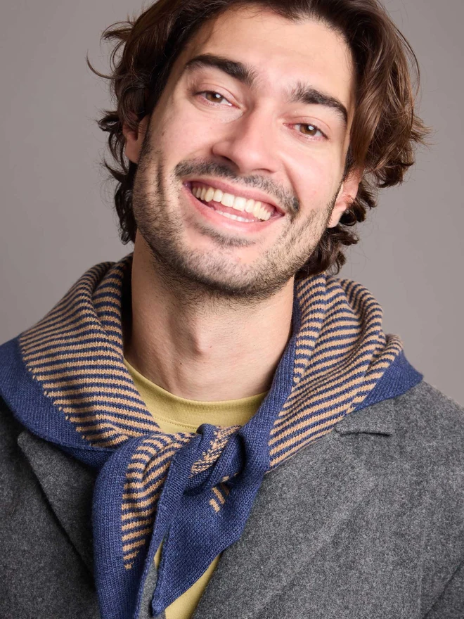 man wearing navy blue and soft brown striped wool neckerchief