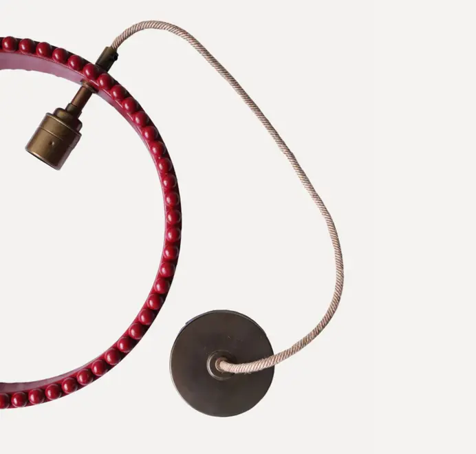 ring shaped pendant lamp in red with bobbin rim