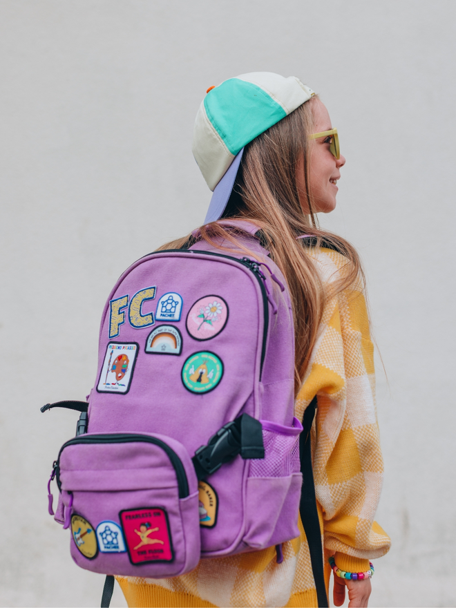 Alphabet patches on a back pack