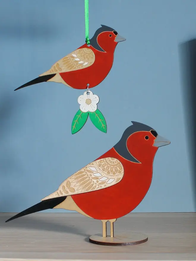Standing Wooden Chaffinch, red wooden bird decoration standing on a platform. 