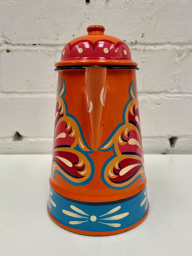 Vintage orange coffee pot, hand-painted with a traditional fairground design in pink, red and blue.