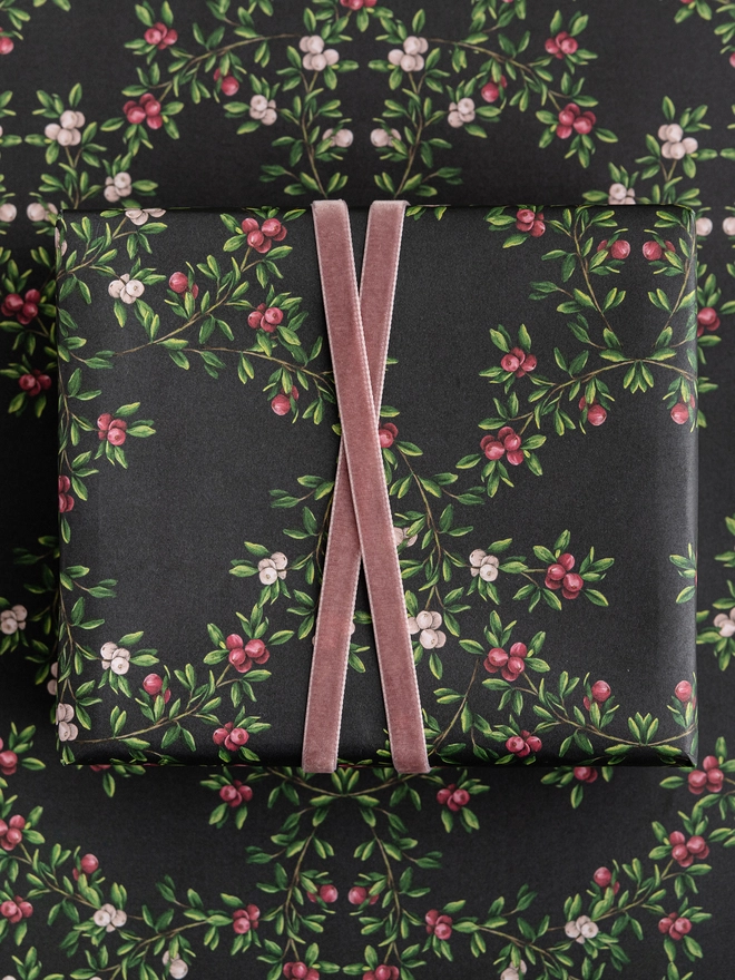 dark navy base with a pink and red berry pattern